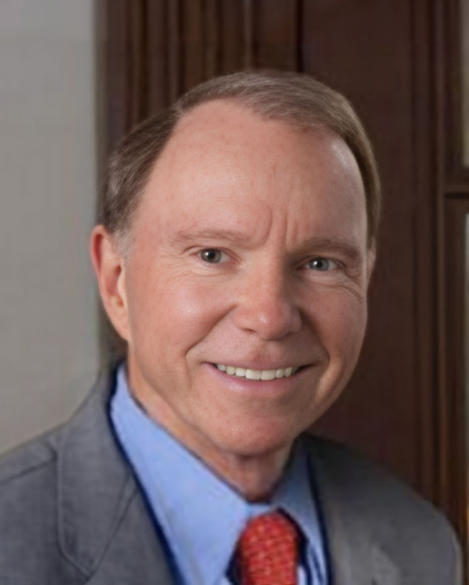 Headshot of Attorney Walter L. Floyd smiling in a gray suit